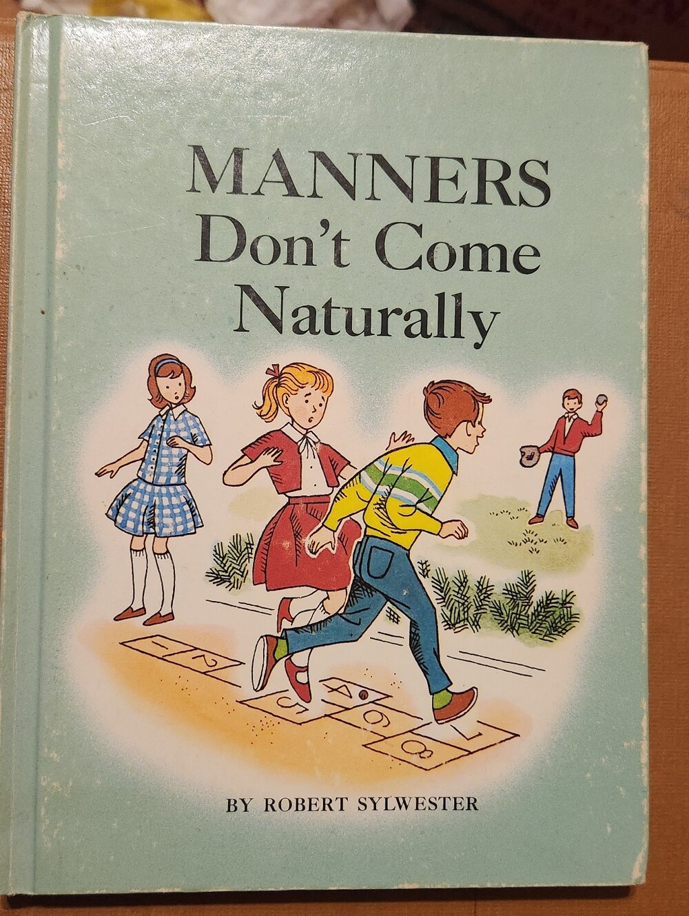 Manners Don't Come Naturally by Robert Sylwester